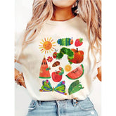 A Global Seasonal Women'S T-Shirt In white Color, Featuring A Colorful Design (Including The Sun, Caterpillar, Fruits, Butterflies, Etc.), With A Playful And Artistic Style